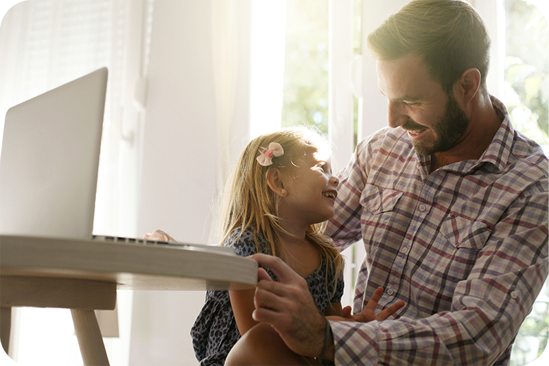 A father laughing with his daughter