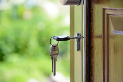 House keys in the door lock of a property with fiber internet.