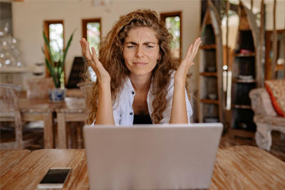 A woman working at her laptop