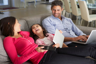 A family playing on their electronic devices