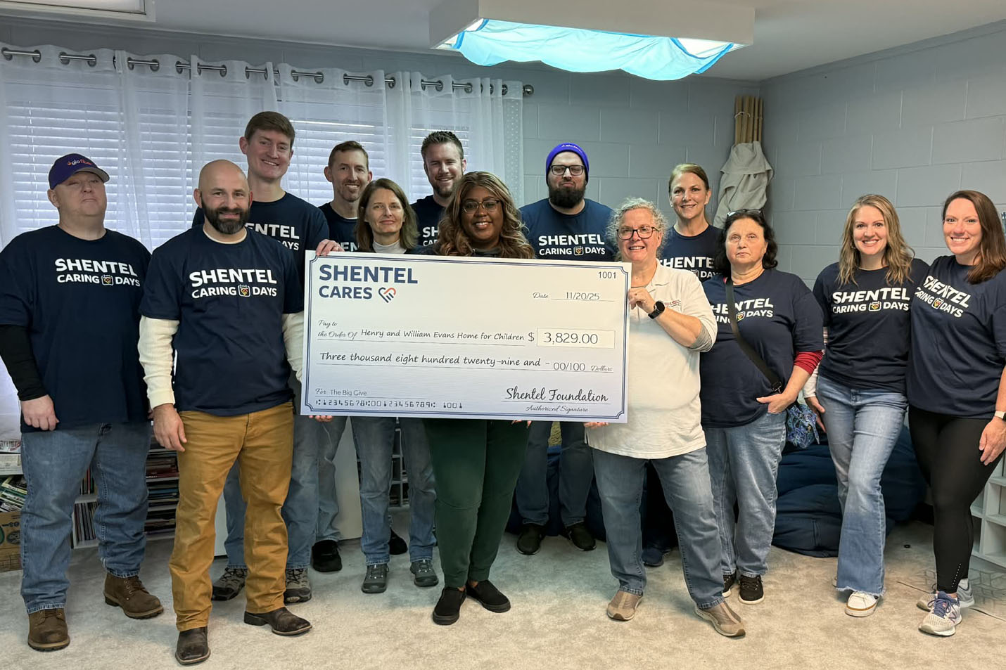 Shentel employees holding a check for charity