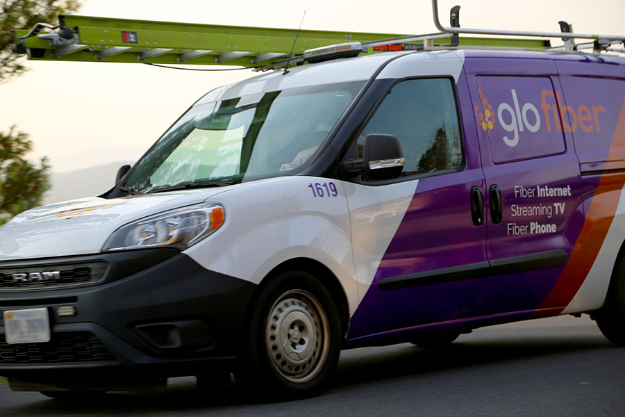 Moving shot of a Glo Fiber Technician van