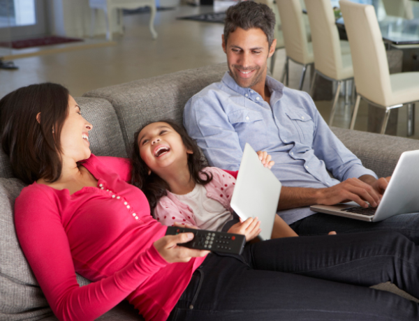 Mother and daughter sharing laptop experience